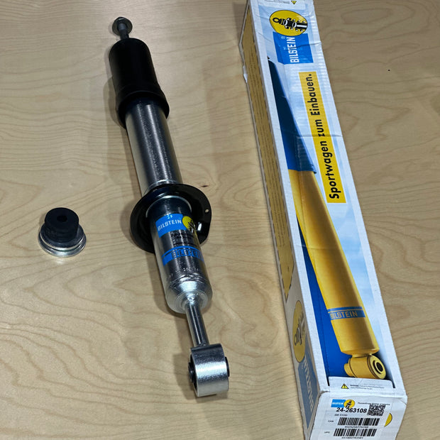 Bilstein 5100 Front Strut shock absorber with ride height adjustment capability, shown with packaging.