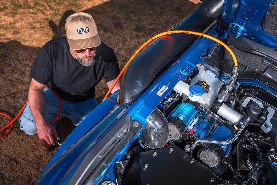 ARB brushless twin motor air compressor fully installed and mounted in a vehicle.