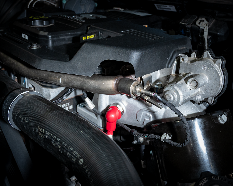Fleece Performance Intake Horn and Grid Heater Kit installed on a 6.7L Cummins engine