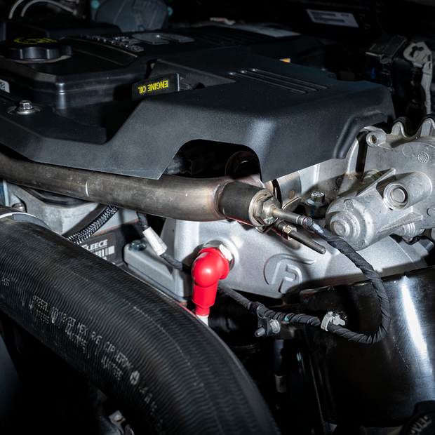 Fleece Performance Intake Horn and Grid Heater Kit installed on a 6.7L Cummins engine